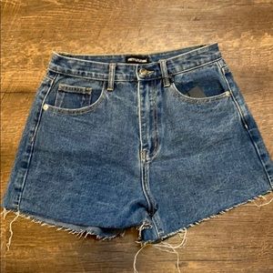 Mid blue wash raw hem jean shorts